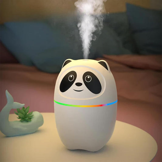 Panda-shaped humidifier emitting mist on a table with a blurred background