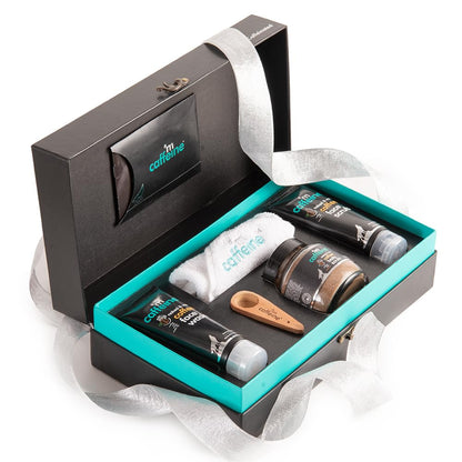 Grooming kit with various items in a black and turquoise box, featuring the 'm caffeine' brand.