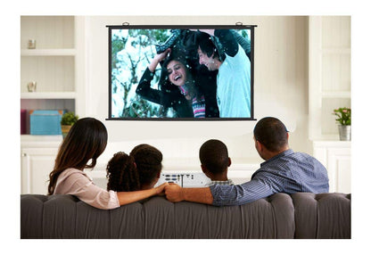 Family watching a movie on a large screen in a living room.