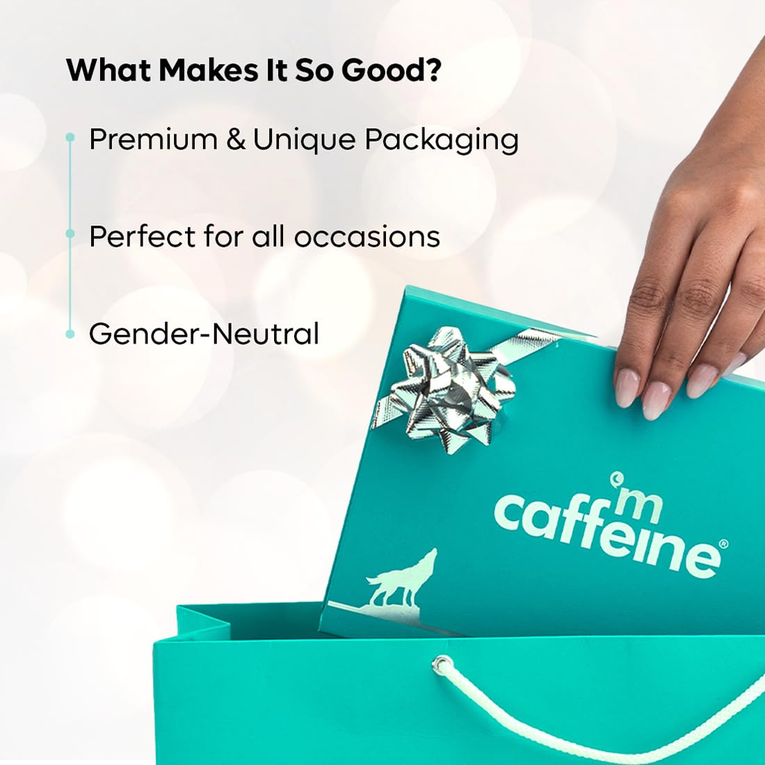 Turquoise gift box with 'caffé m caffeine' branding, held by a hand, on a white background.