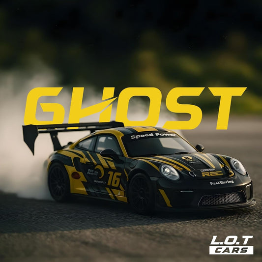 Yellow and black racing car with 'GHOST' text on a blurred background