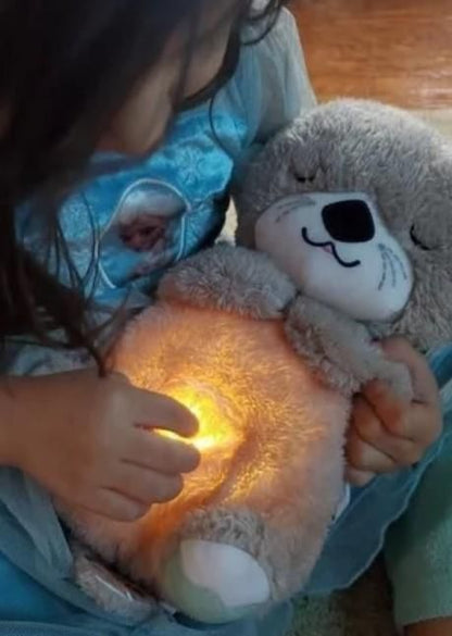 Child holding a glowing plush toy