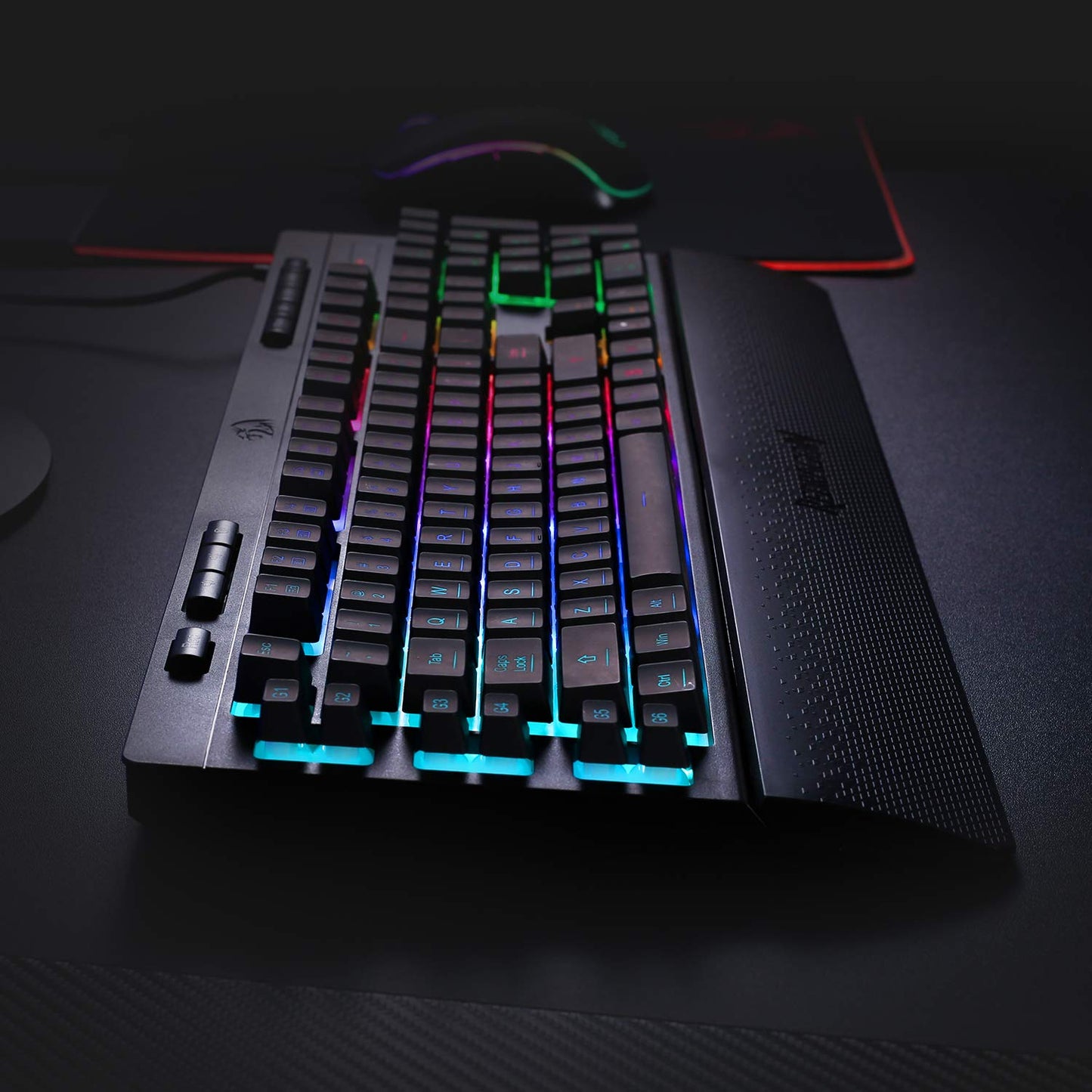 Gaming keyboard with RGB lighting on a dark surface