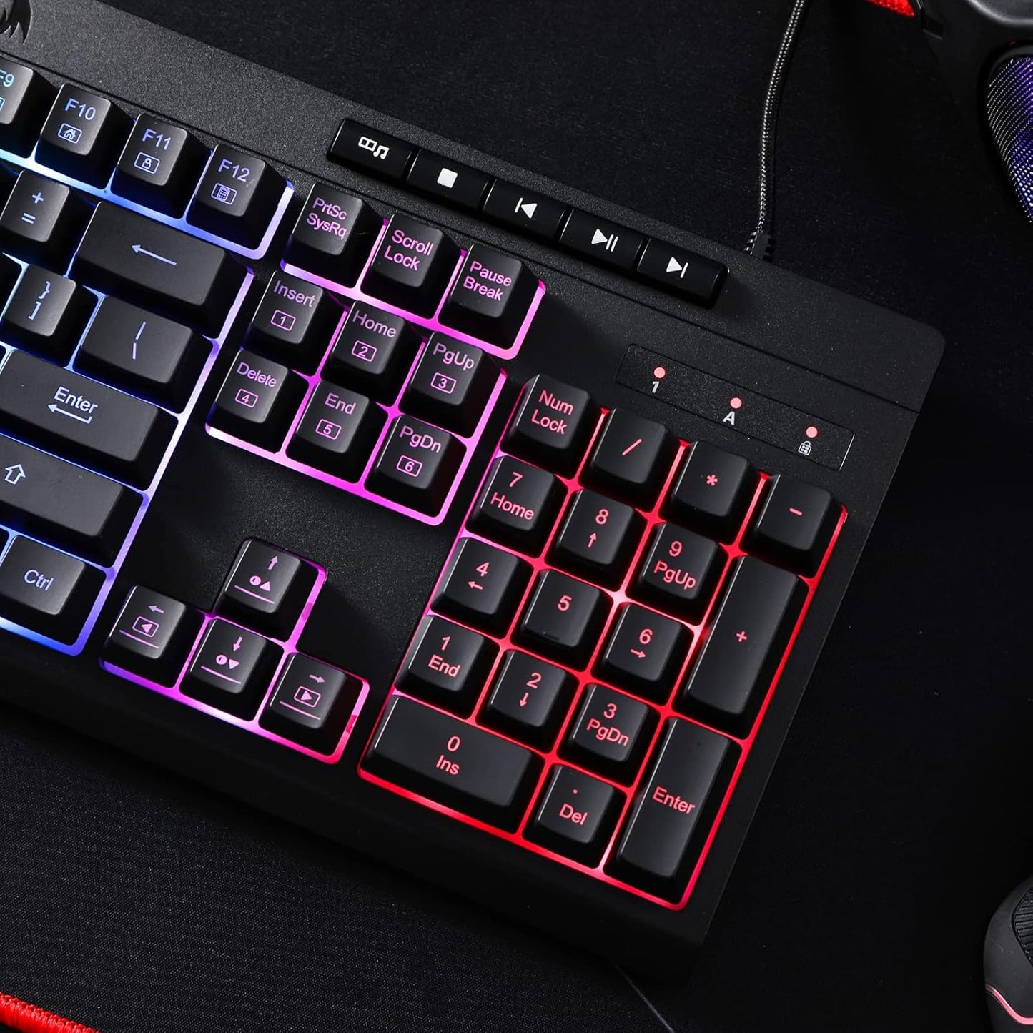 Black keyboard with RGB lighting on a dark background