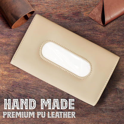 Beige leather tissue holder on a wooden surface with 'Hand Made Premium PU Leather' text.